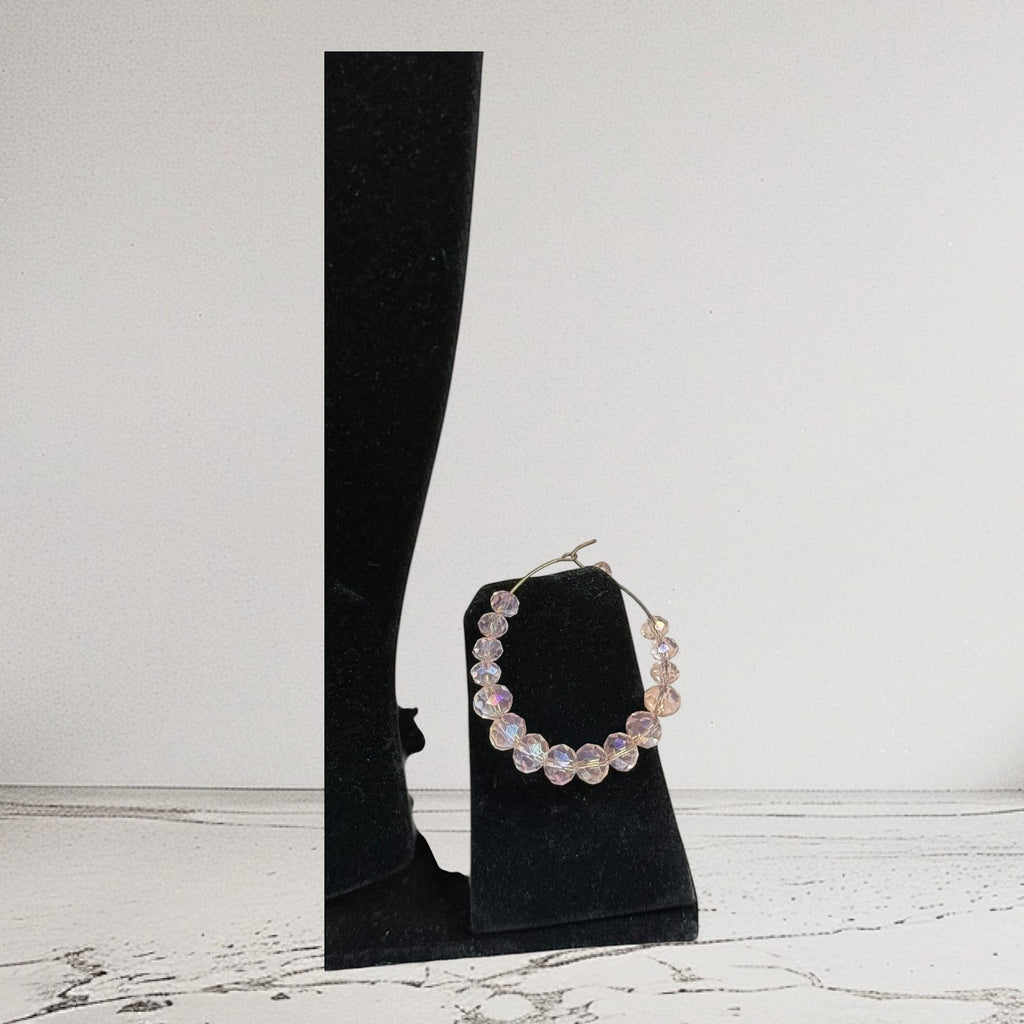 Handmade Trinkets champagne gold-tone hoop earrings with iridescent crystal beads.
