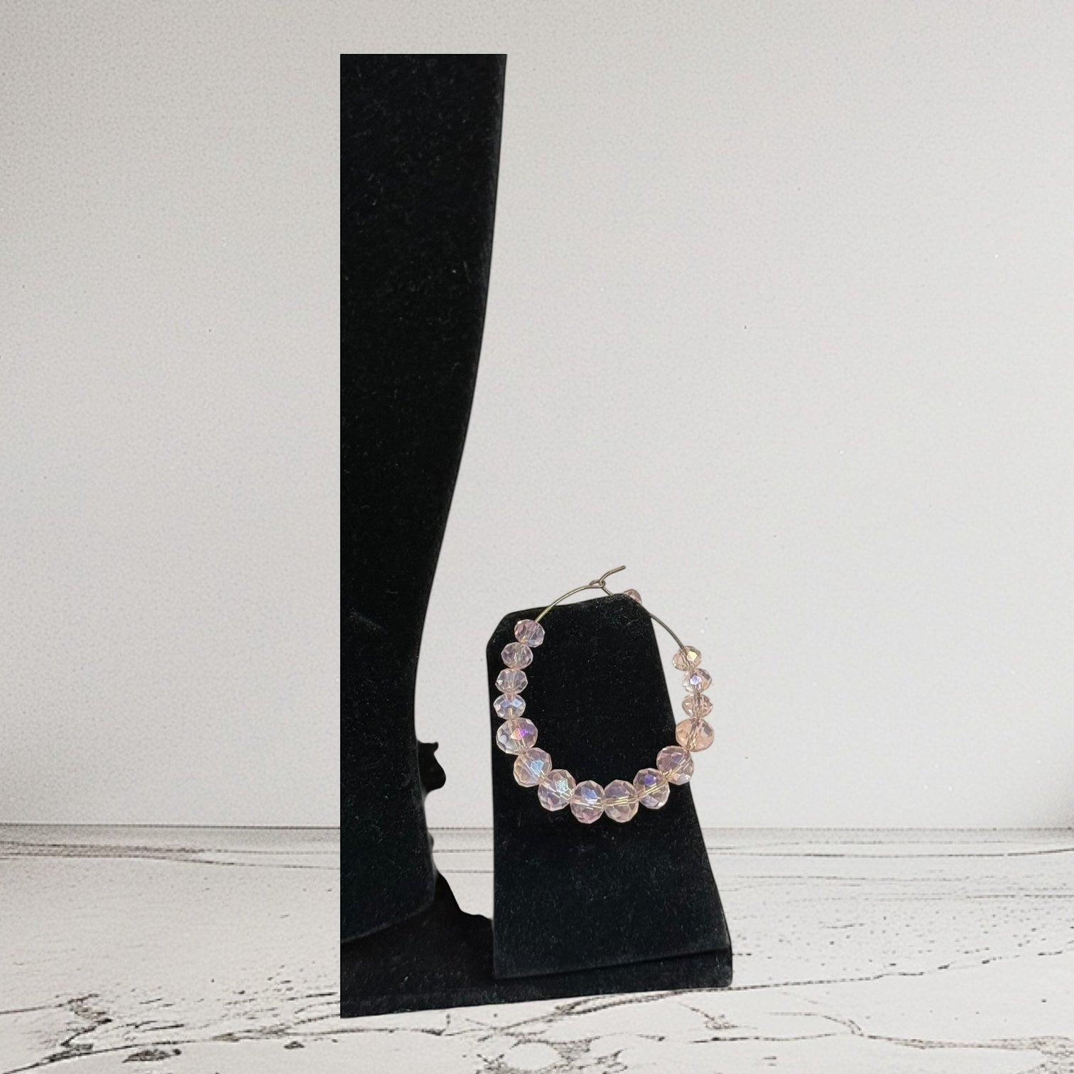 Handmade Trinkets champagne gold-tone hoop earrings with iridescent crystal beads.